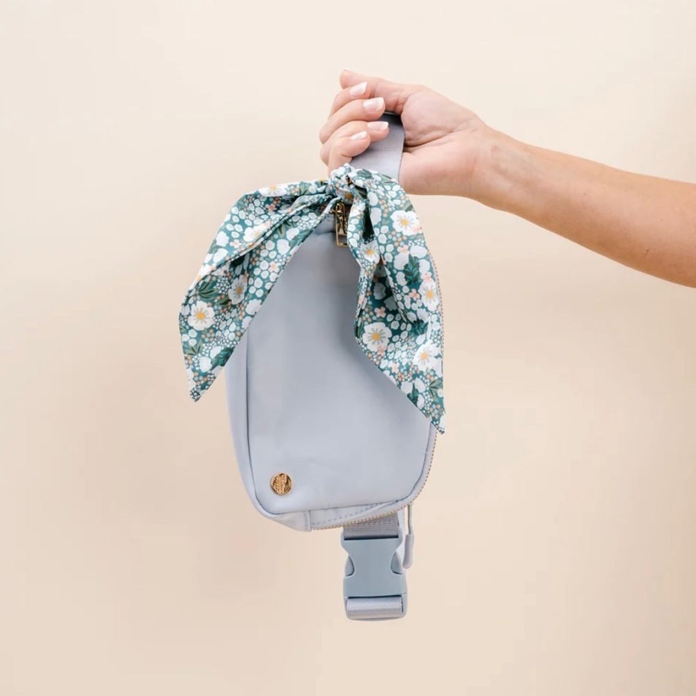 Belt bag with flowered detachable scarf